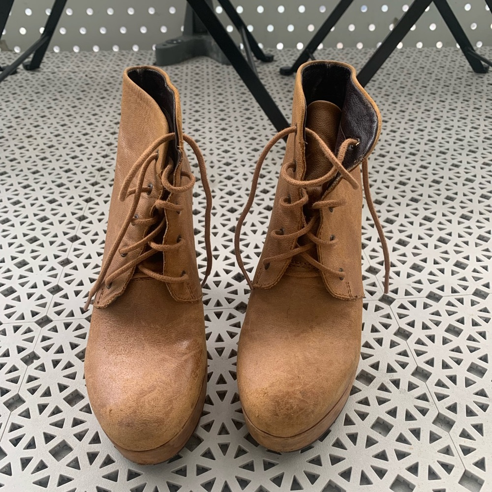 Steve Madden camel brown lace-up booties, in a 3 in. heel.